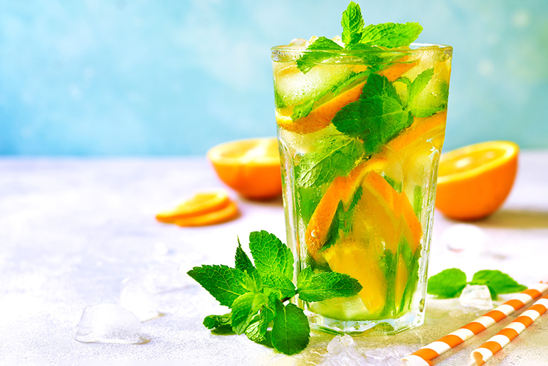 Orange And Mint Drink In Glass
