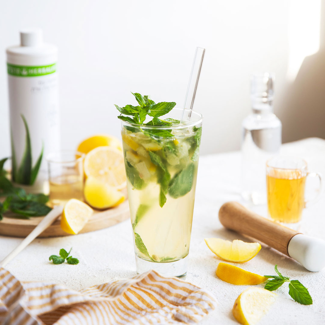herbalife nutrition refreshing glass of aloemax drink with added lemon and mint