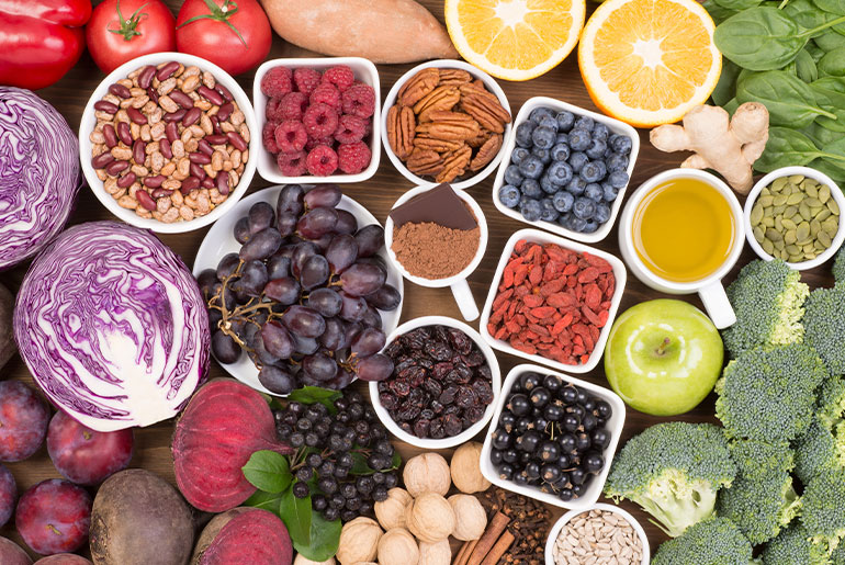 Overhead shot of micronutrient-rich nuts, fruits, berries and vegetables
