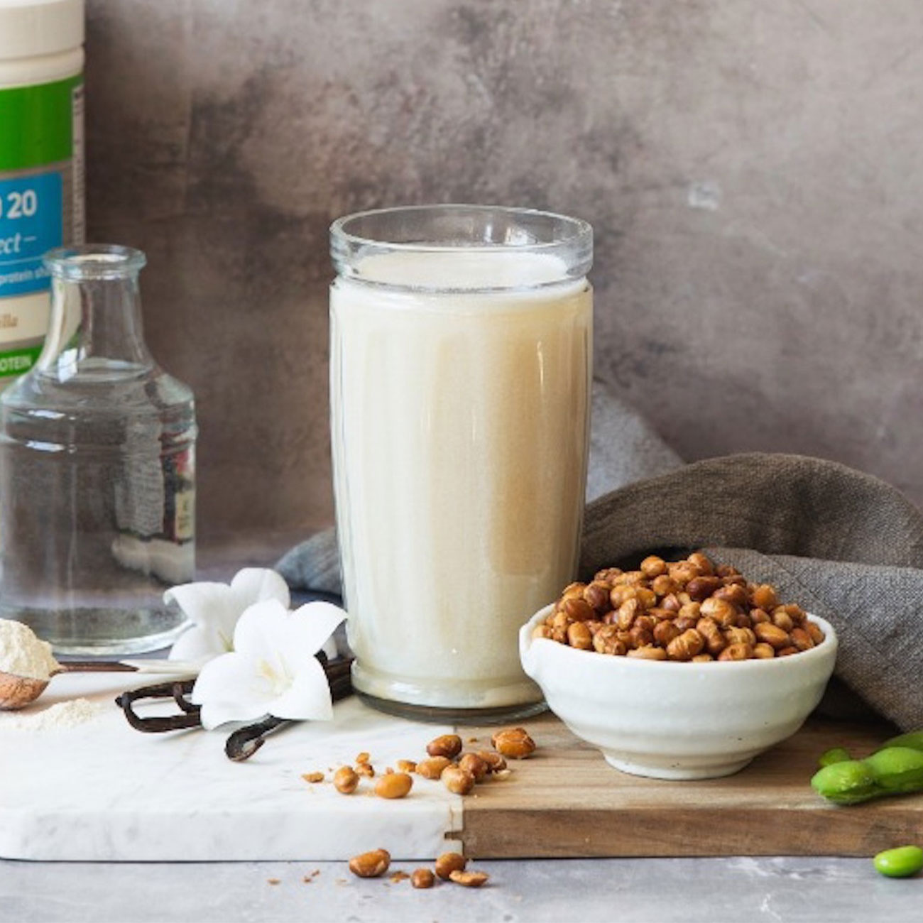 Glass of Pro20 Select protein drink and a bowl of roasted soy beans