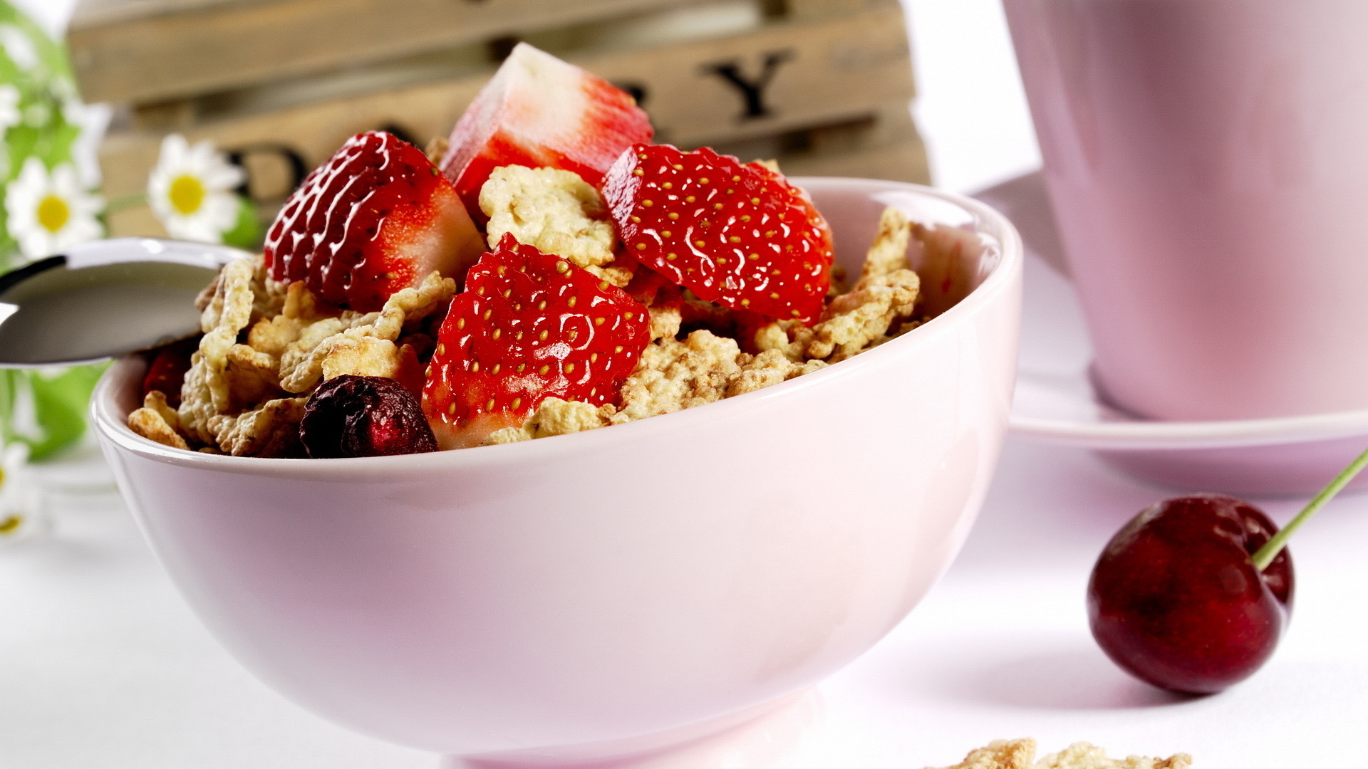 A bowl of healthy oats with strawberry slices as topping