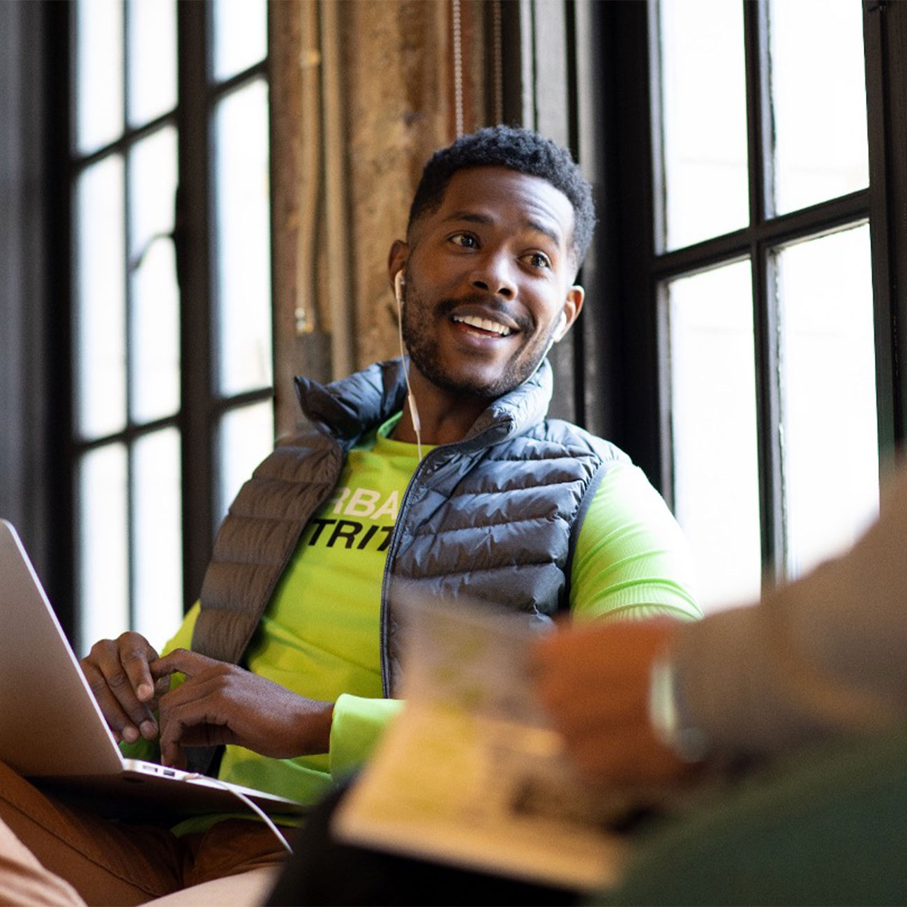 herbalife nutrition distributor smiling and working from his laptop