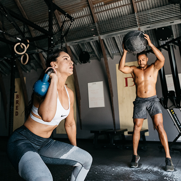 Image of a man and a woman doing CrossFit together